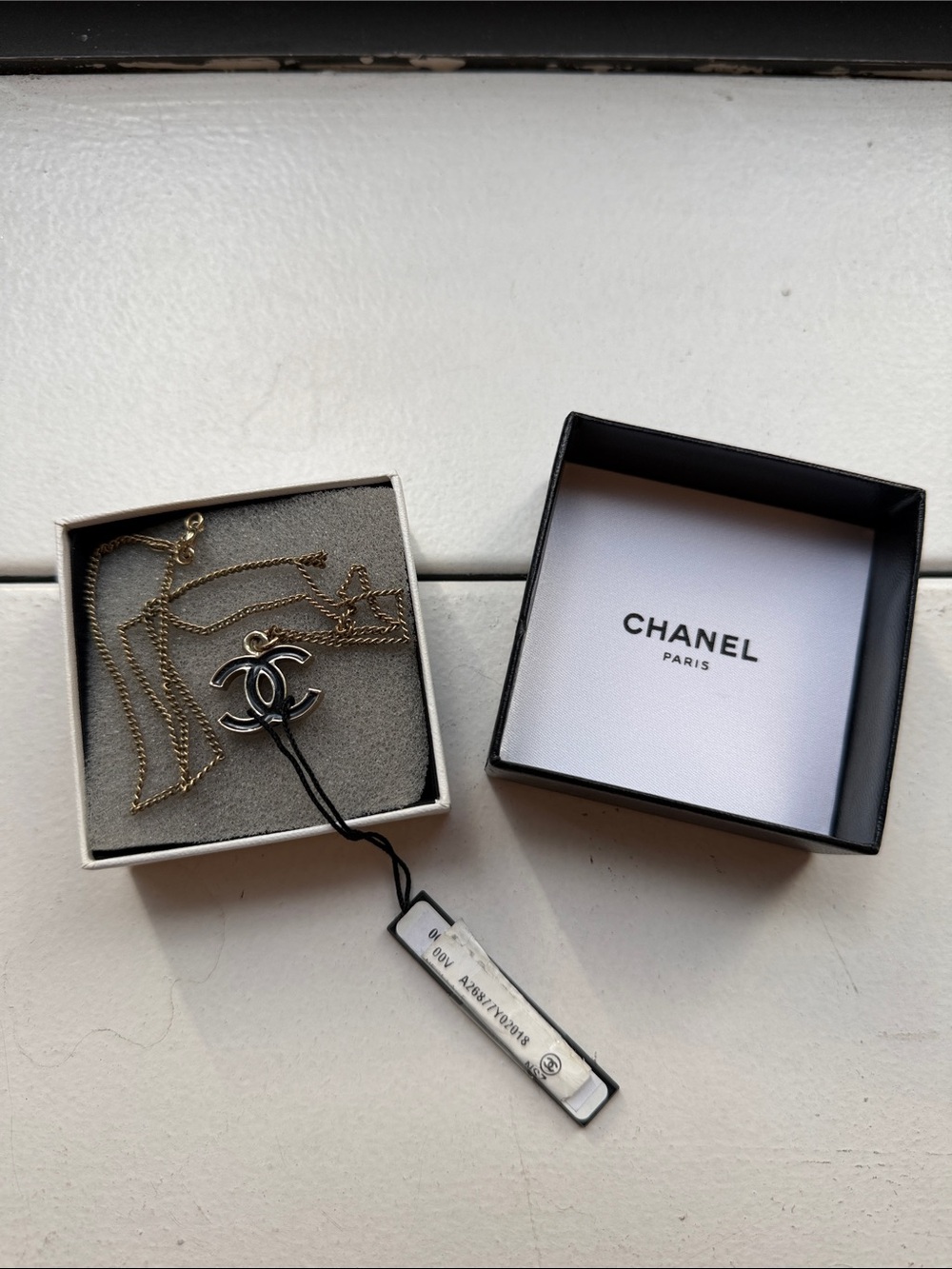 CHANEL Silver-Trimmed Gold CC Pendant Necklace